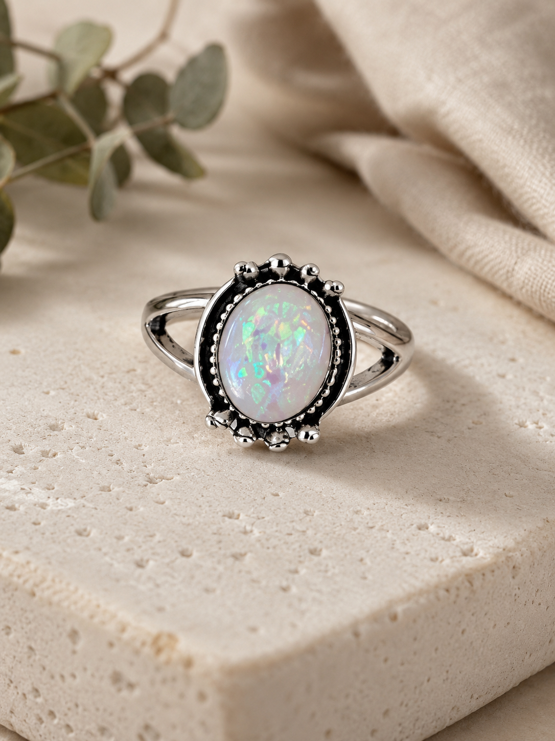 Moonstone-like glass stone ring with intricate detail size 16