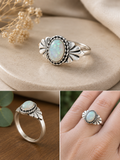 Oval shaped moonstone glass stone ring with leaf detail on sides size 17